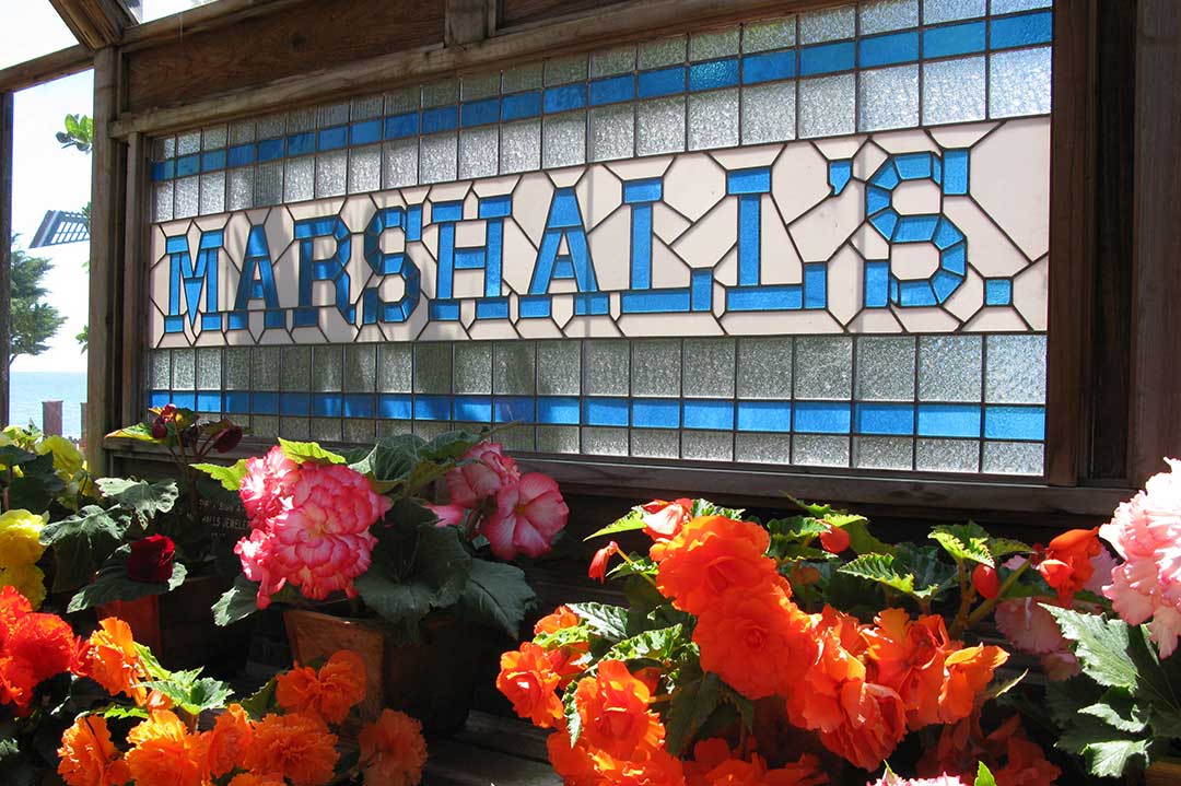 Marshall’s stained glass window showcases Rose Chapman’s prize-winning begonias. Photo: Blake Andrews | SLOtography